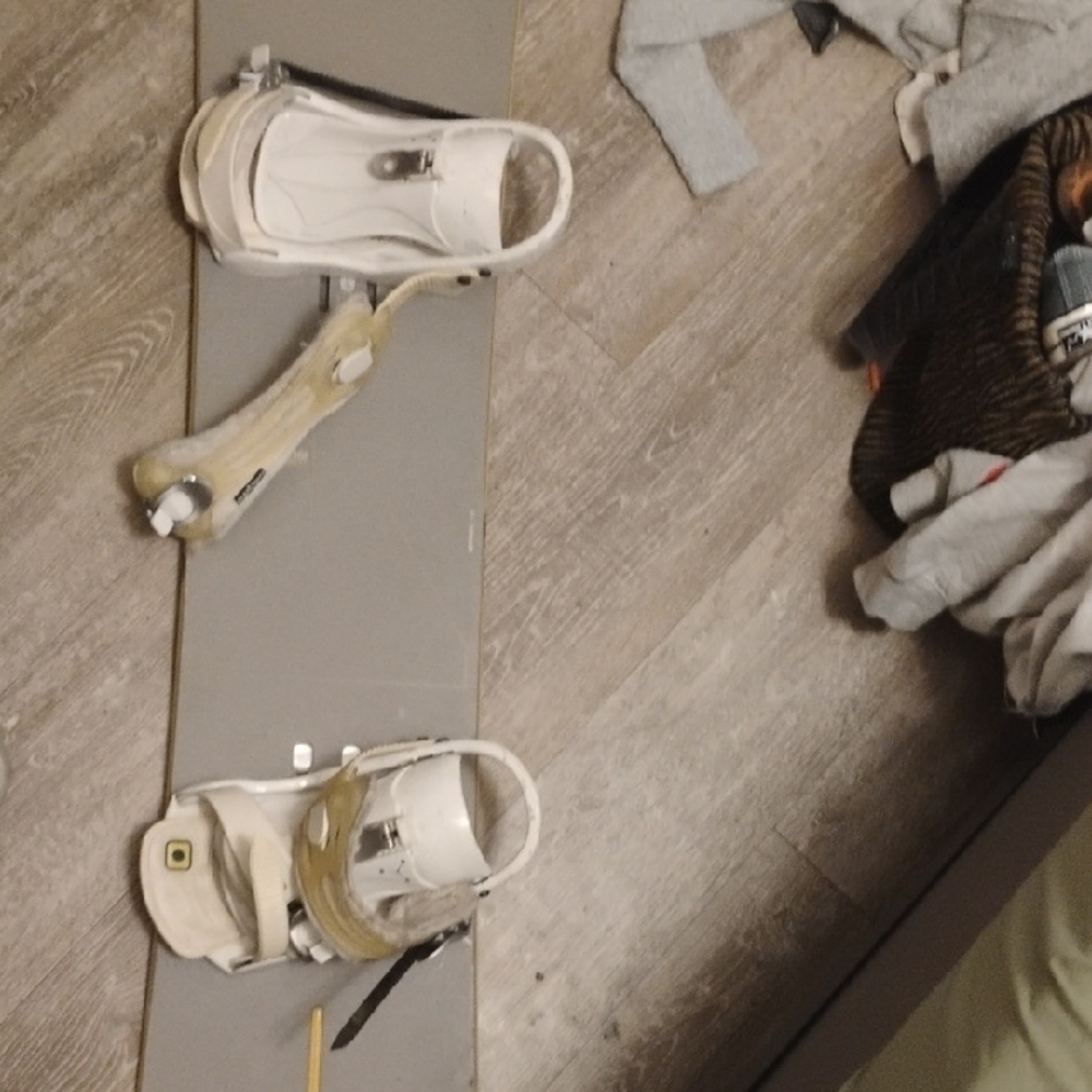 Sleek Gray Snowboard with White Bindings